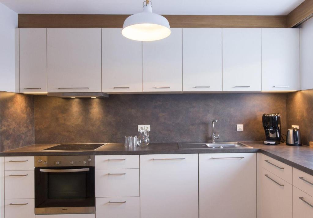 Kuchyň nebo kuchyňský kout v ubytování Ferienhaus Alpavera