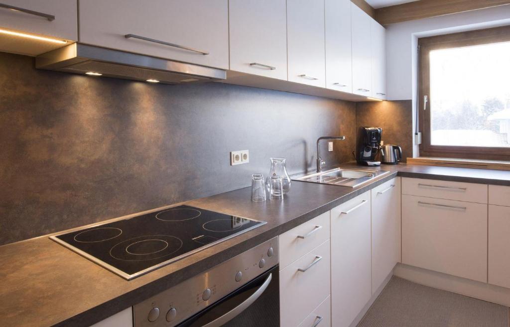Kuchyň nebo kuchyňský kout v ubytování Ferienhaus Alpavera