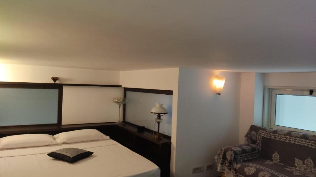 A bed or beds in a room at San Giovanni Lovely Loft