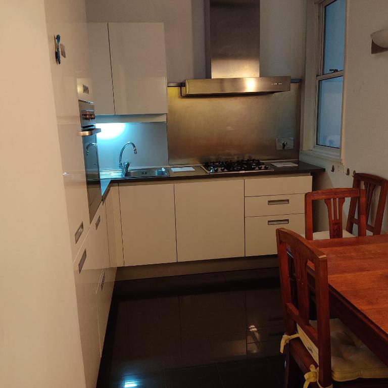 A kitchen or kitchenette at San Giovanni Lovely Loft