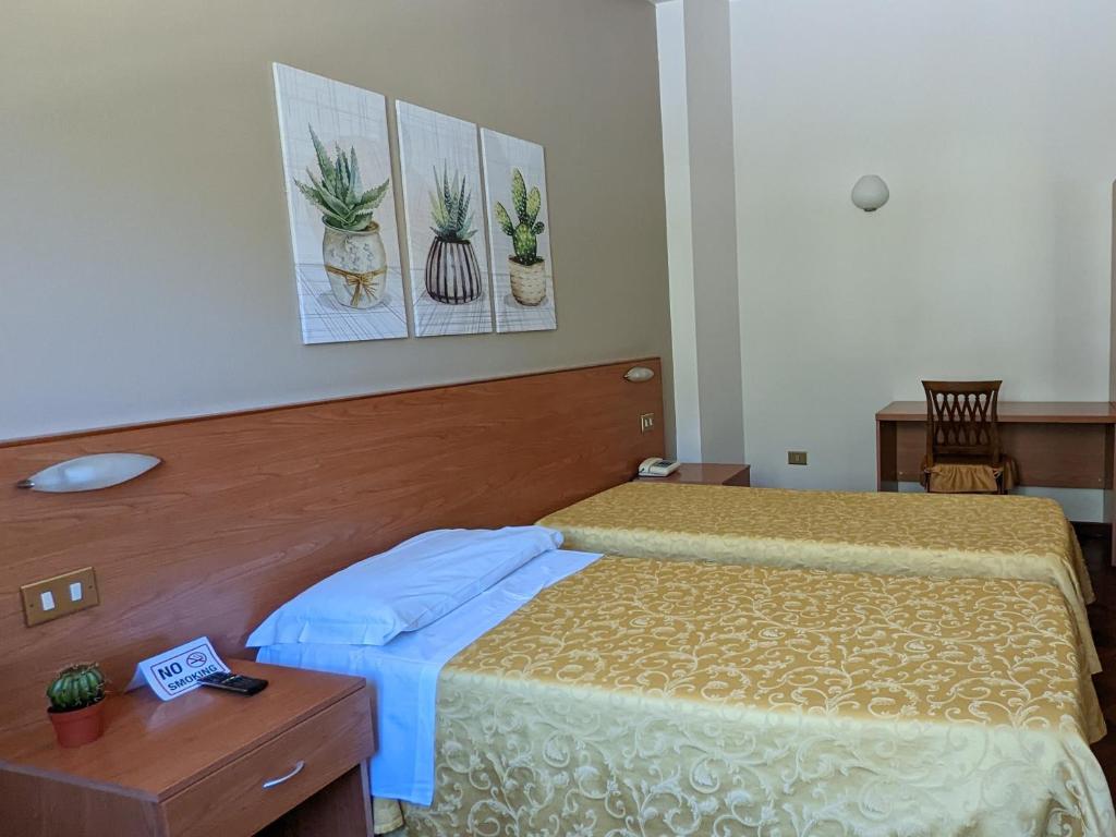Postel nebo postele na pokoji v ubytování Hotel Del Sole