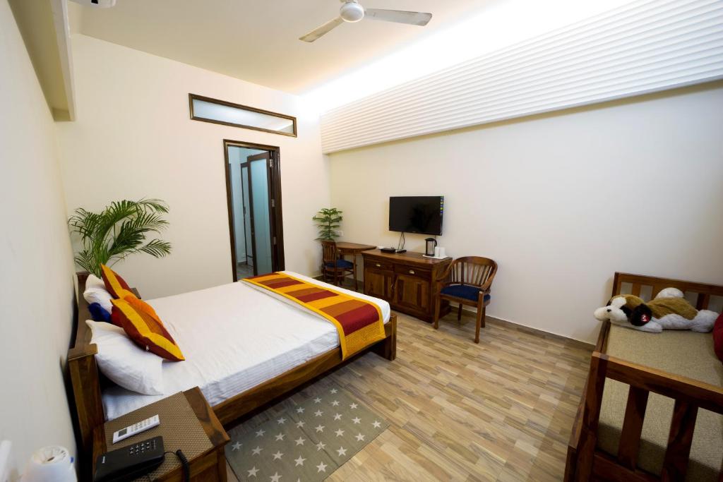 Mojo M Villa -Airport Boutique Hotel客房内的一张或多张床位