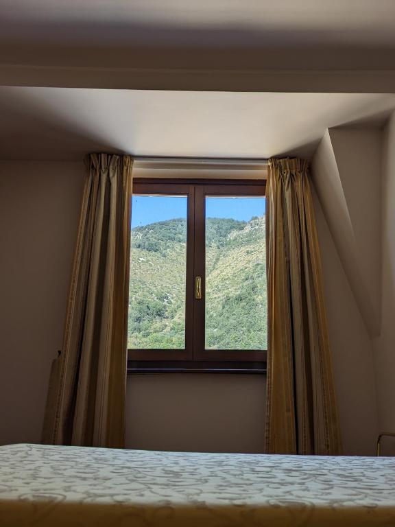 Postel nebo postele na pokoji v ubytování Hotel Del Sole