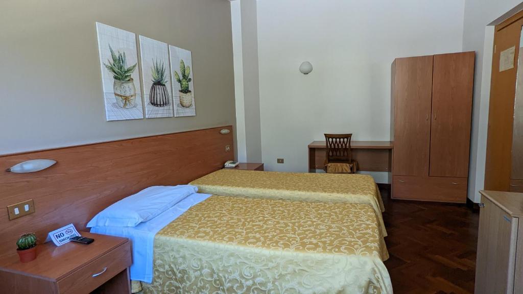 Postel nebo postele na pokoji v ubytování Hotel Del Sole