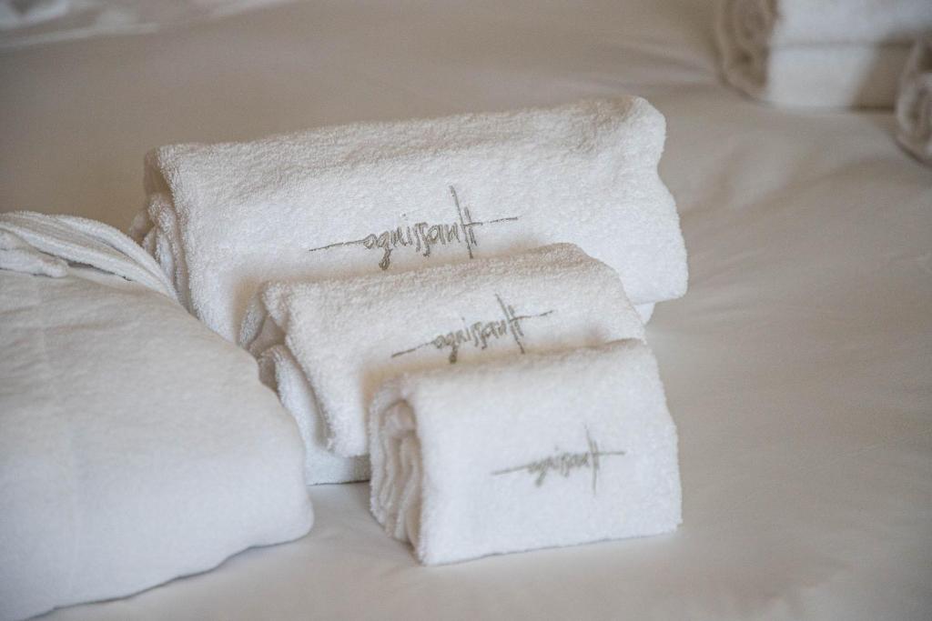 A bed or beds in a room at Ognissanti Restaurant Spa Hotel Rooftop