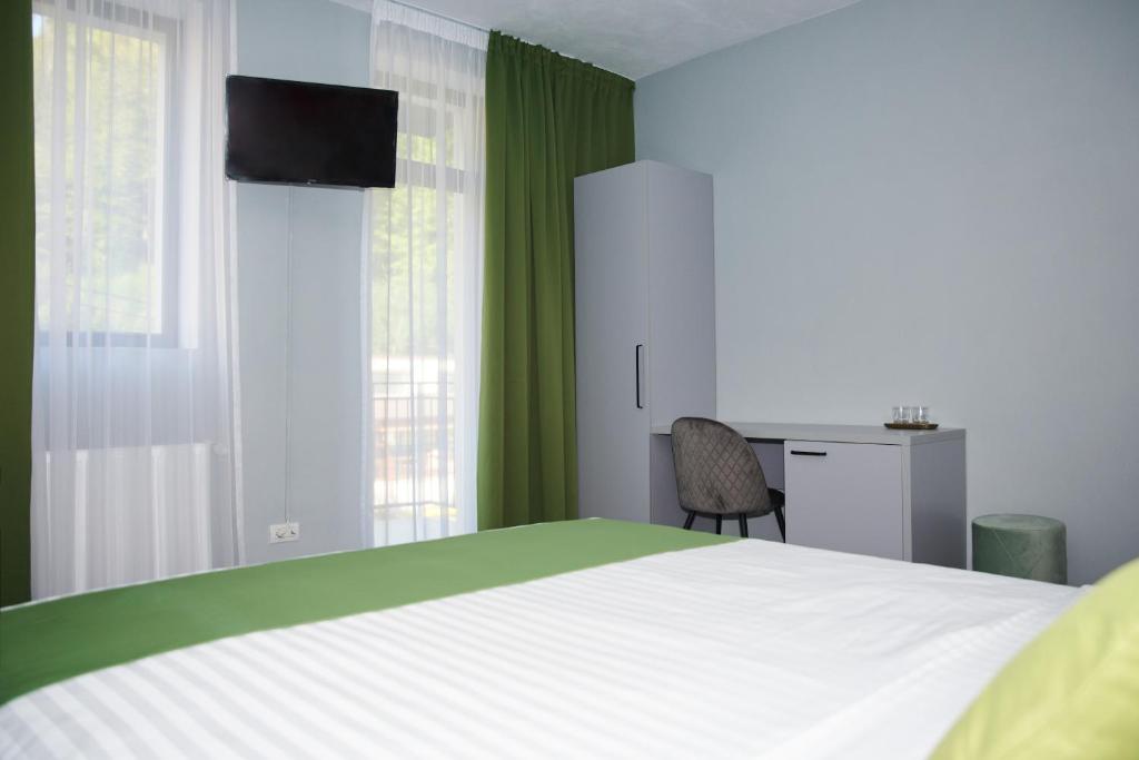 Postel nebo postele na pokoji v ubytování Astra Hotel