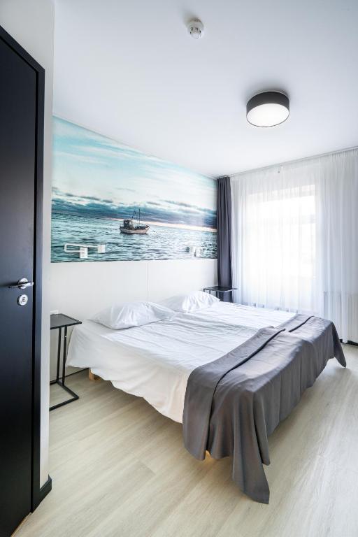 Postel nebo postele na pokoji v ubytování Hotel NOSPA