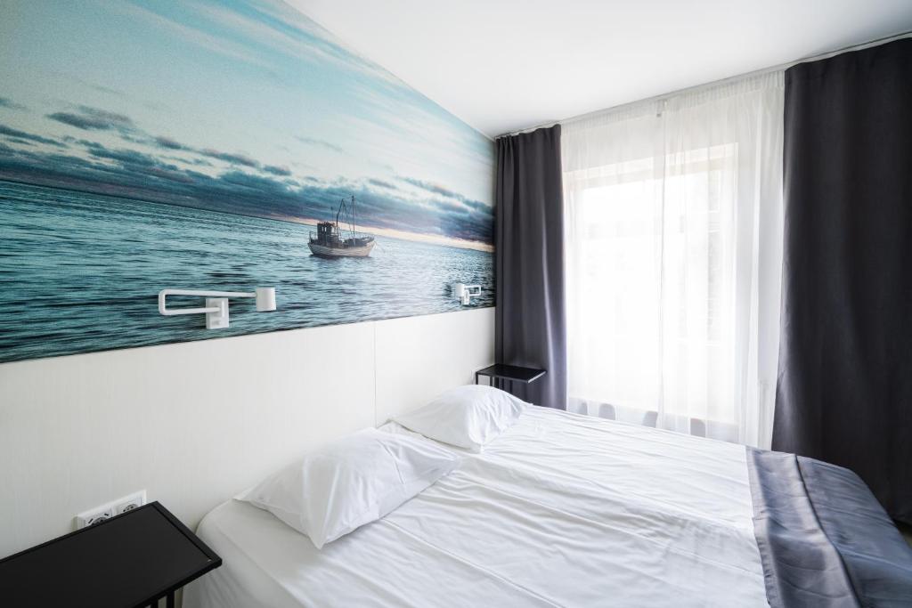 Postel nebo postele na pokoji v ubytování Hotel NOSPA