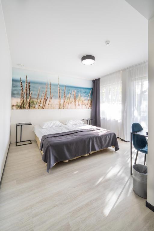 Postel nebo postele na pokoji v ubytování Hotel NOSPA