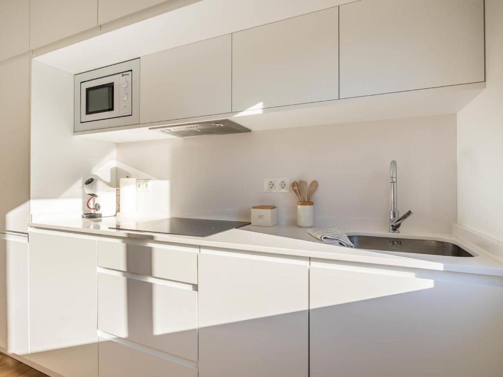 Kuchyňa alebo kuchynka v ubytovaní Gran plaza home - Vacacional Sevilla