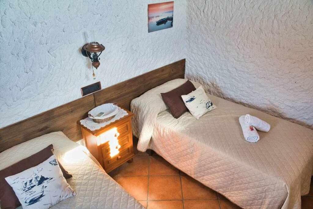 Łóżko lub łóżka w pokoju w obiekcie El Valle Dorado