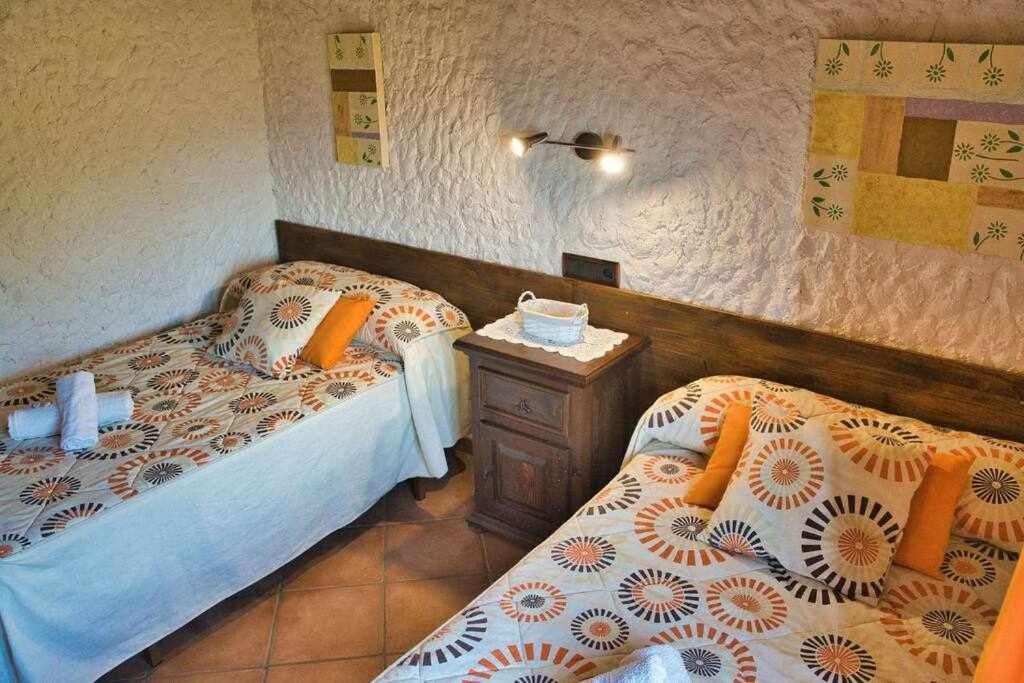 Łóżko lub łóżka w pokoju w obiekcie El Valle Dorado