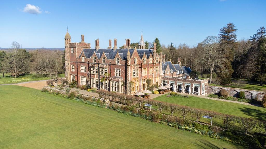 an aerial view of a large house on a field at Horsted Place Hotel in Uckfield