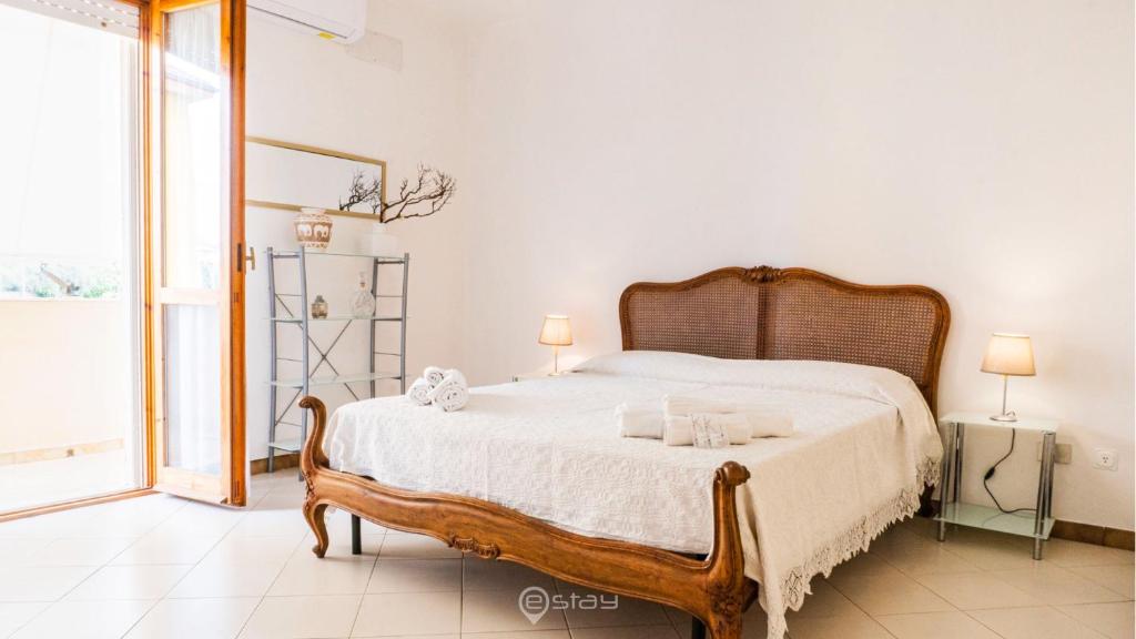 Кровать или кровати в номере 2 Balconies Apartment - Wonderful Alghero