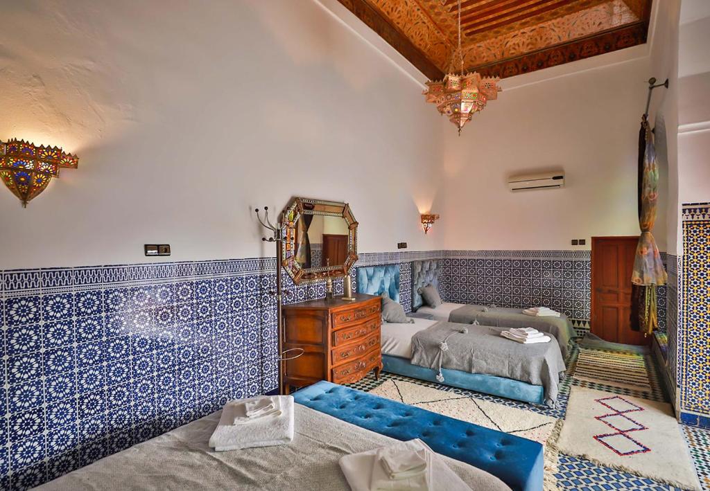 Postel nebo postele na pokoji v ubytování Riad Dar Jeanne