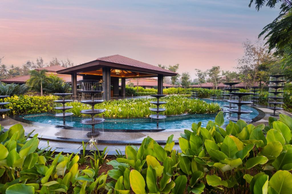 a resort with a fountain and a gazebo at Denissons Beach Resort, formerly Gamyam Retreat in Kumta