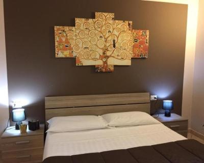 Postel nebo postele na pokoji v ubytování ALBERGO ELENA 3 via emilia ovest 347