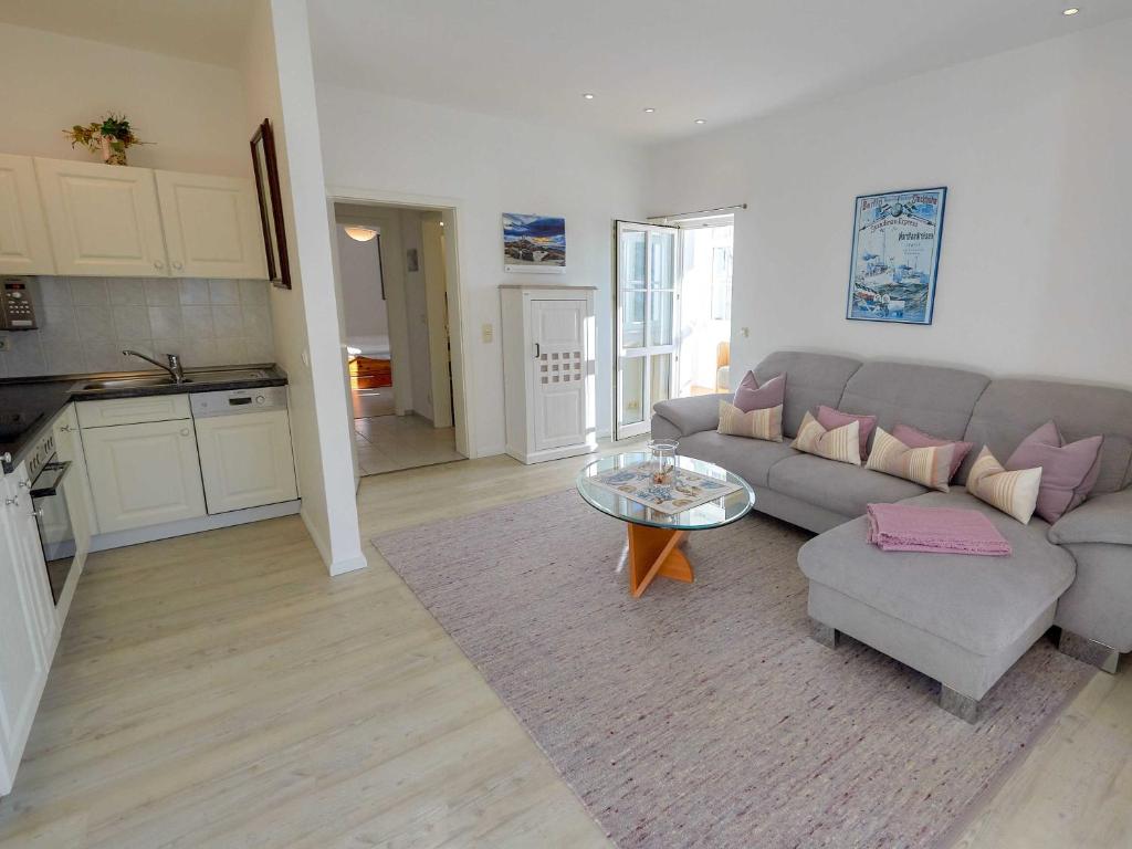 a living room with a couch and a table at Villa Li - Fewo 06 "Sonneninsel" in Ostseebad Sellin