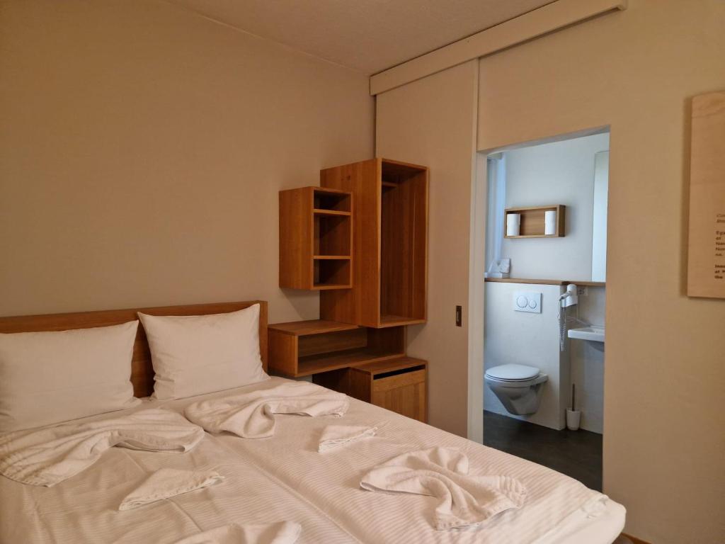Postel nebo postele na pokoji v ubytování Easy-Living Buholz Hoch 12