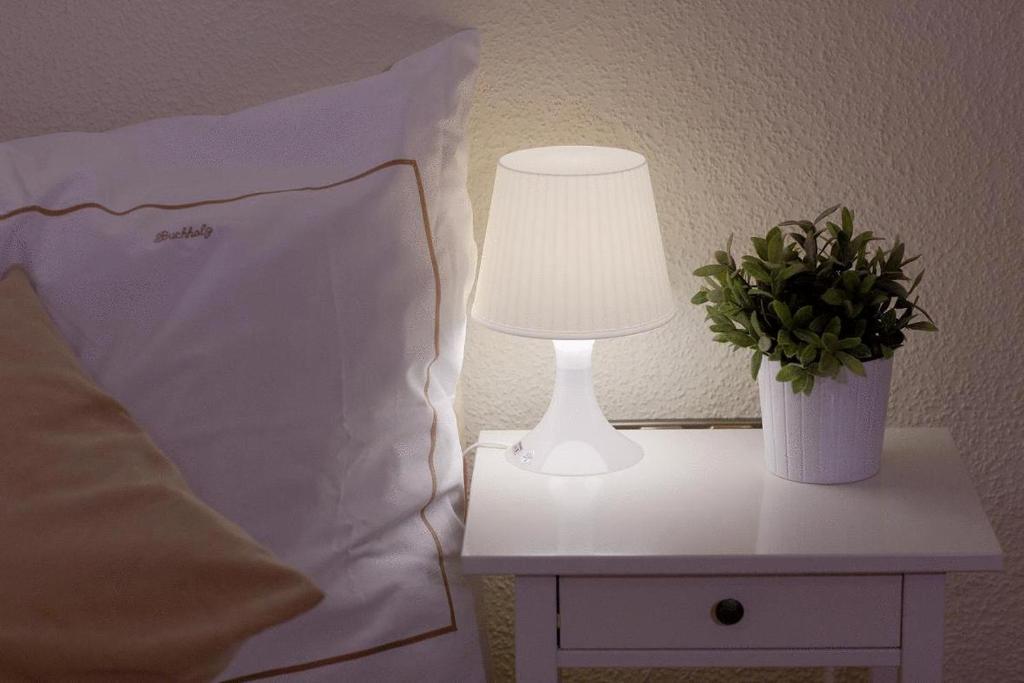 Postel nebo postele na pokoji v ubytování Buchholz Downtown Hotel