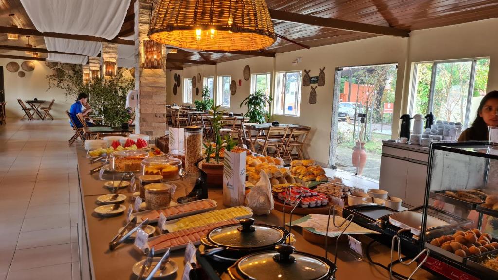 a buffet line with many different types of food at Arena Carneiros Hotel by AFT in Tamandaré