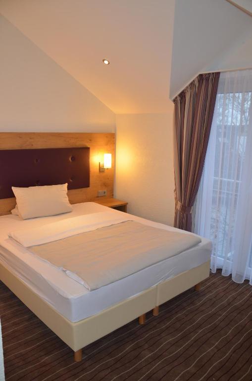 Postel nebo postele na pokoji v ubytování Hotel- Restaurant Poststuben