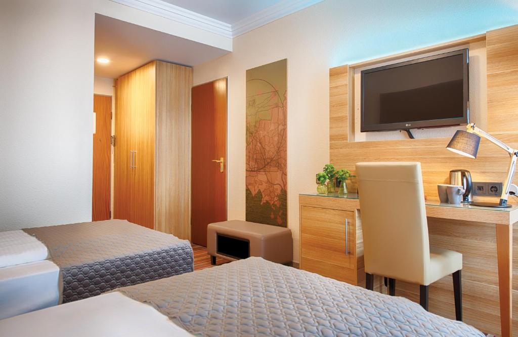 TV a/nebo společenská místnost v ubytování Leonardo Hotel Hamburg Stillhorn