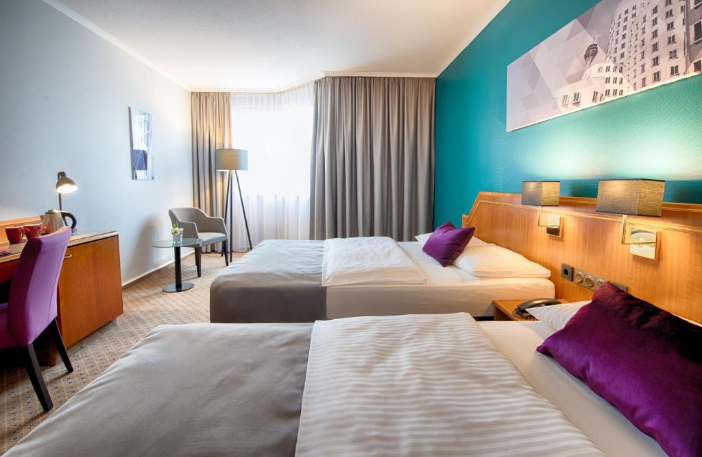 Ένα ή περισσότερα κρεβάτια σε δωμάτιο στο Leonardo Hotel Düsseldorf City Center