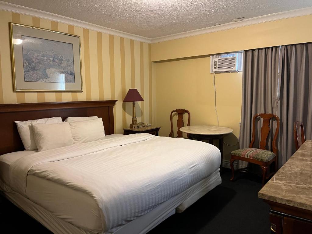 Postel nebo postele na pokoji v ubytování Island Travel Inn