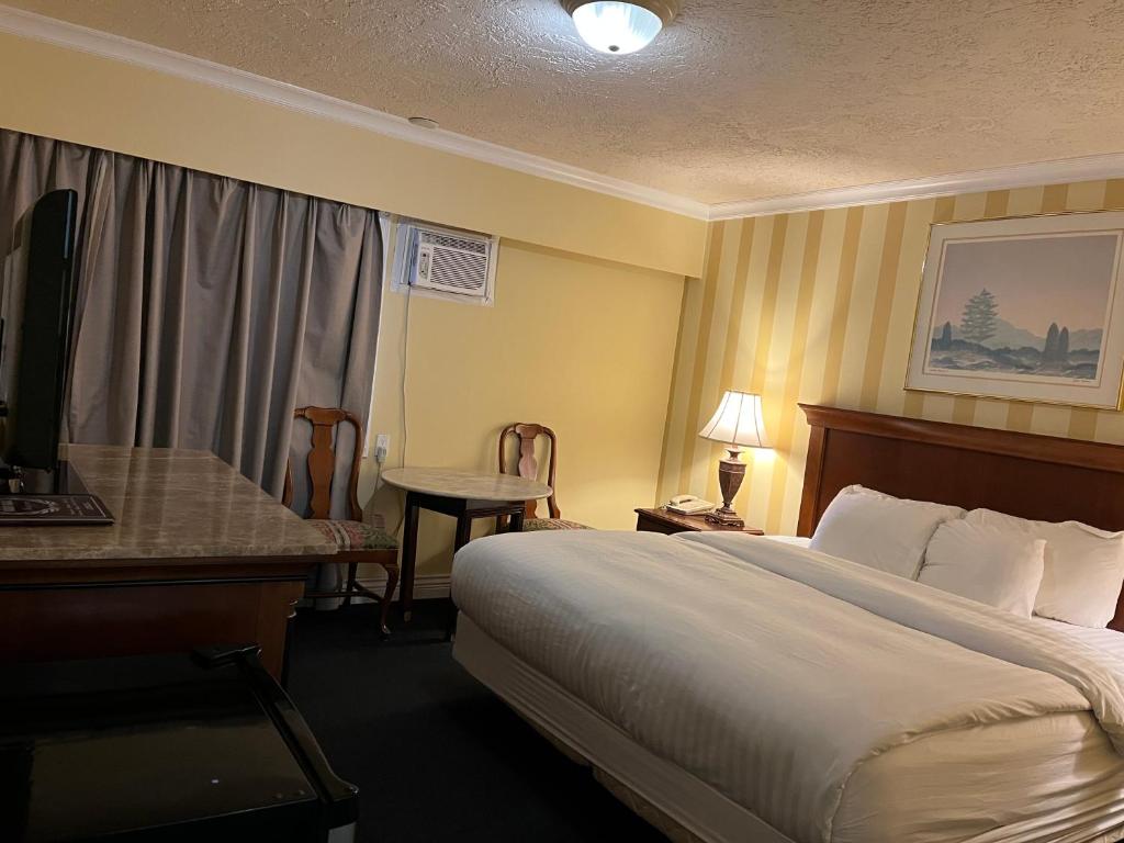 Postel nebo postele na pokoji v ubytování Island Travel Inn