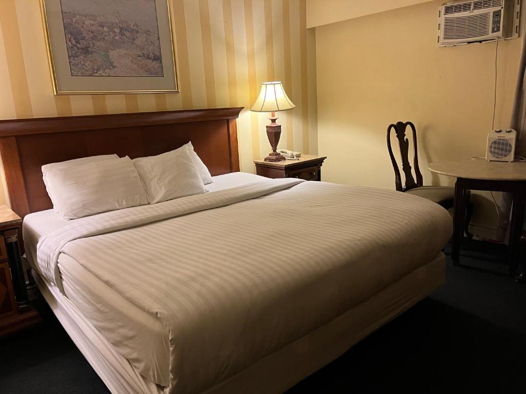 Postel nebo postele na pokoji v ubytování Island Travel Inn