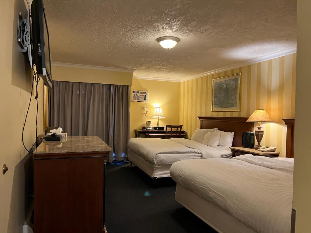 Postel nebo postele na pokoji v ubytování Island Travel Inn