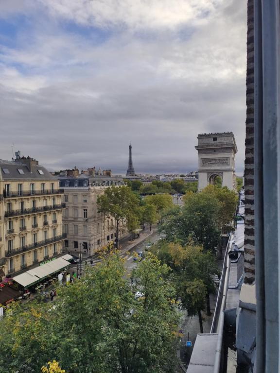 a view of a city with the eiffel tower at Place de l'Etoile, Wagram in Paris