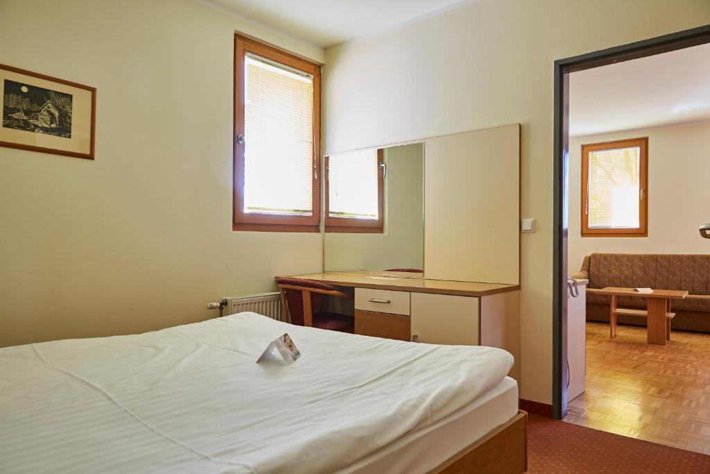 Postel nebo postele na pokoji v ubytování Thermal Apartments Lendava