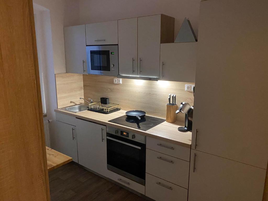 Kuchyň nebo kuchyňský kout v ubytování ApartmentsCarlsbad