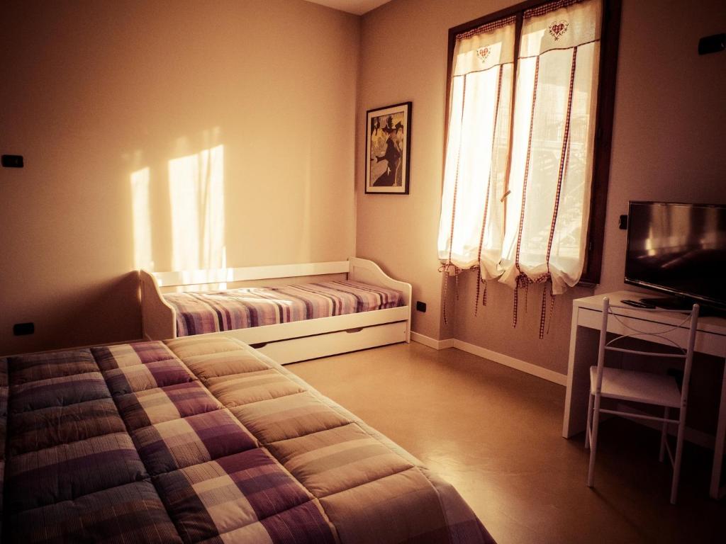 Postel nebo postele na pokoji v ubytování B&B Aurora