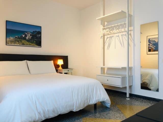 A bed or beds in a room at LoLè Apartment - Ancona