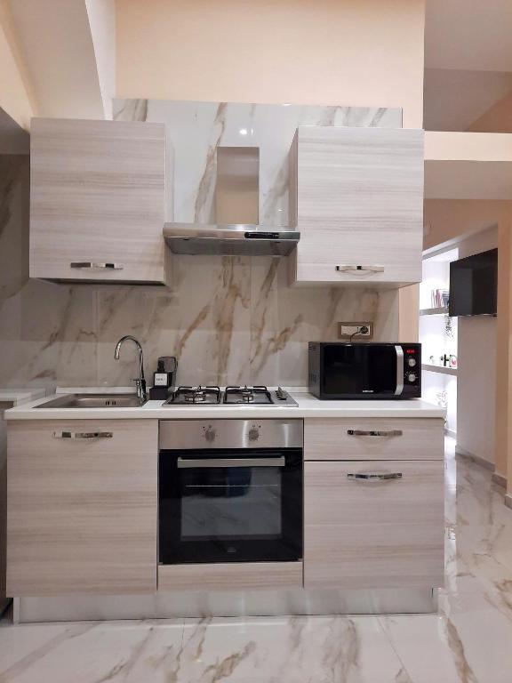 Kuchyňa alebo kuchynka v ubytovaní Re Ferdinando Apartment