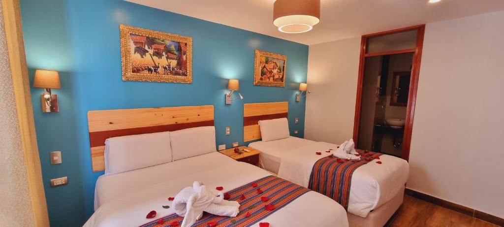 Letto o letti in una camera di HOTEL LUZ GARDEN