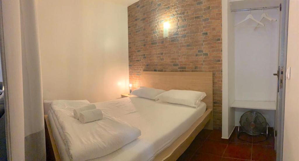 Postel nebo postele na pokoji v ubytování Studio Apartment - Tv da Madalena 05