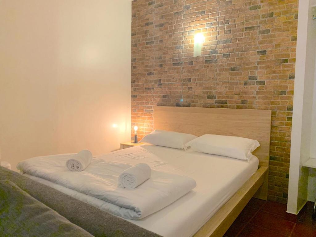 Postel nebo postele na pokoji v ubytování Studio Apartment - Tv da Madalena 05