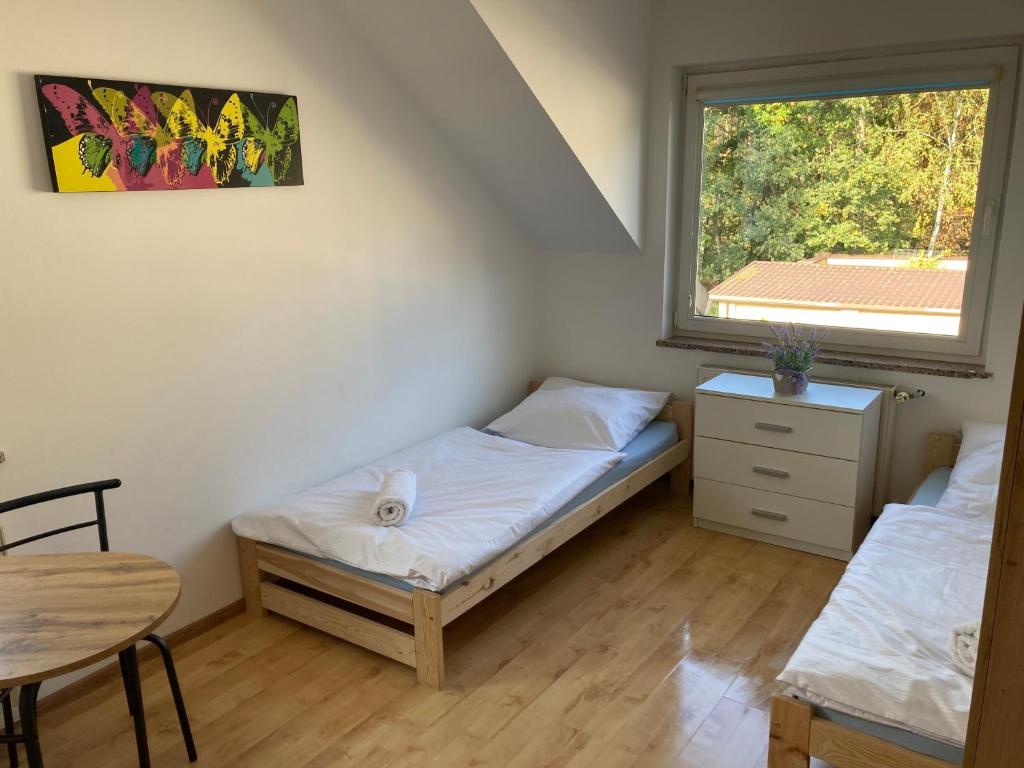Łóżko lub łóżka w pokoju w obiekcie Hostel Dalia