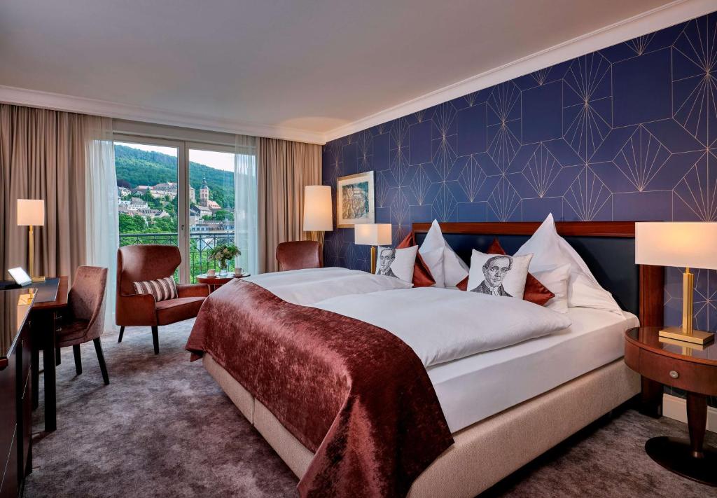 Postel nebo postele na pokoji v ubytování Maison Messmer - ein Mitglied der Hommage Luxury Hotels Collection