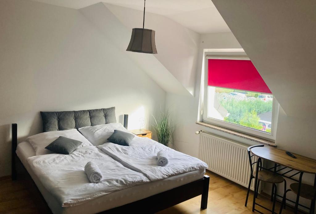 Łóżko lub łóżka w pokoju w obiekcie Hostel Dalia