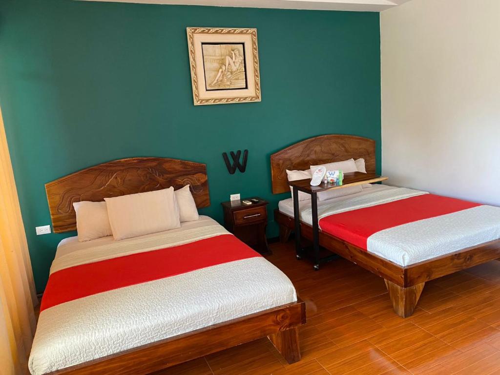 Postel nebo postele na pokoji v ubytování Hotel Wilson Upala