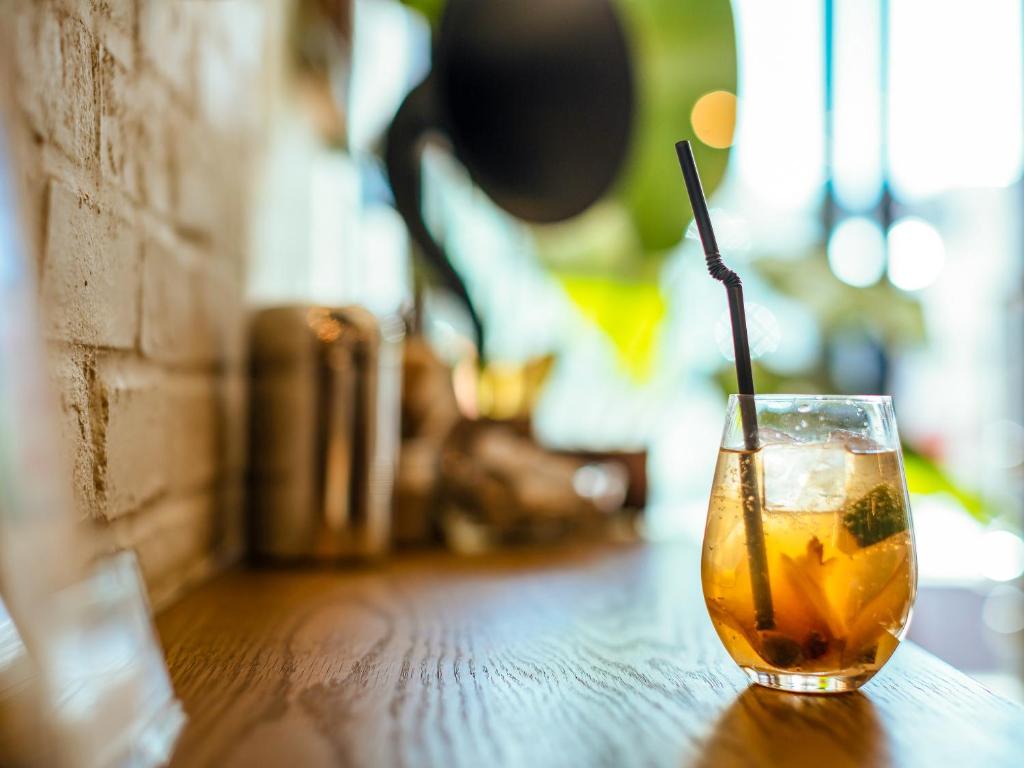 a drink with a straw sitting on a table at Hotel Pacific Kanazawa in Kanazawa
