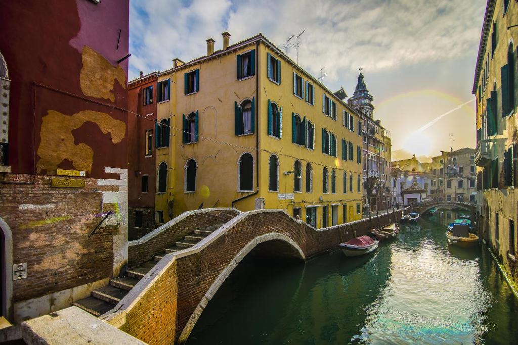 a bridge over a canal in a city with buildings at B&B Le Marie in Venice