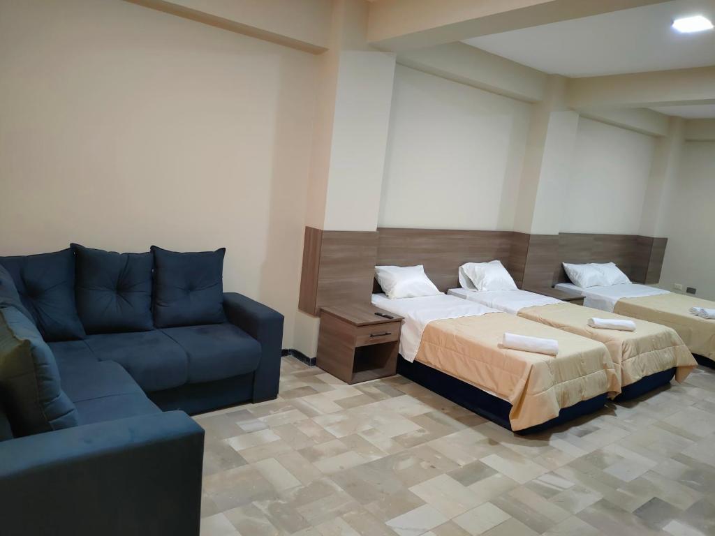 Postel nebo postele na pokoji v ubytování OCEANIk SUITES & HOTEL
