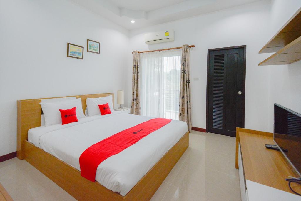 Postel nebo postele na pokoji v ubytování Baan Noppadol Hua Hin Resort