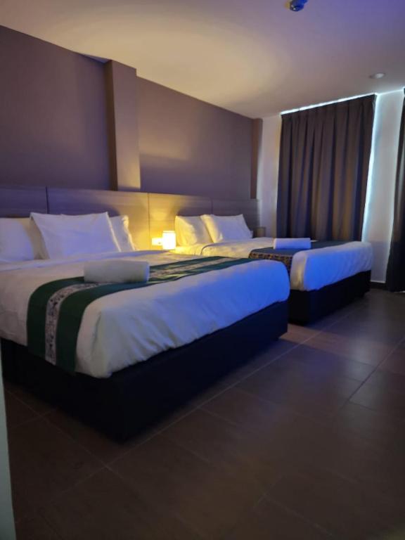 Postel nebo postele na pokoji v ubytování Yu Hotel Chinatown